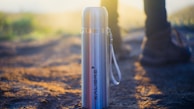 Close-up of a stainless steel thermos with a custom name engraved.