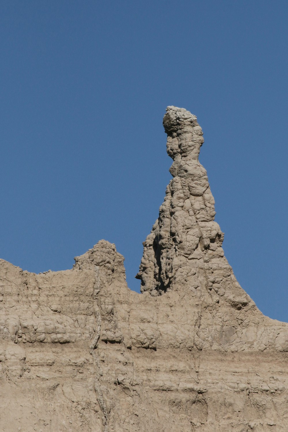 brown rock formation under blue sky during daytime