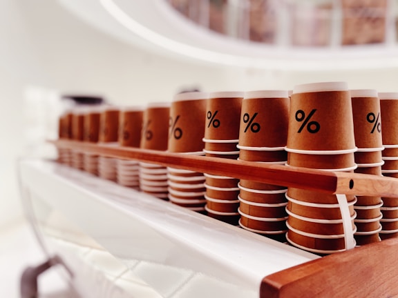 Close-up of eco-friendly cardboard cups stacked neatly on a wooden table