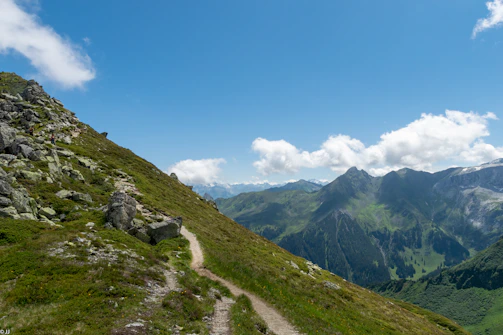 A scenic mountain view from a hiking trail video.