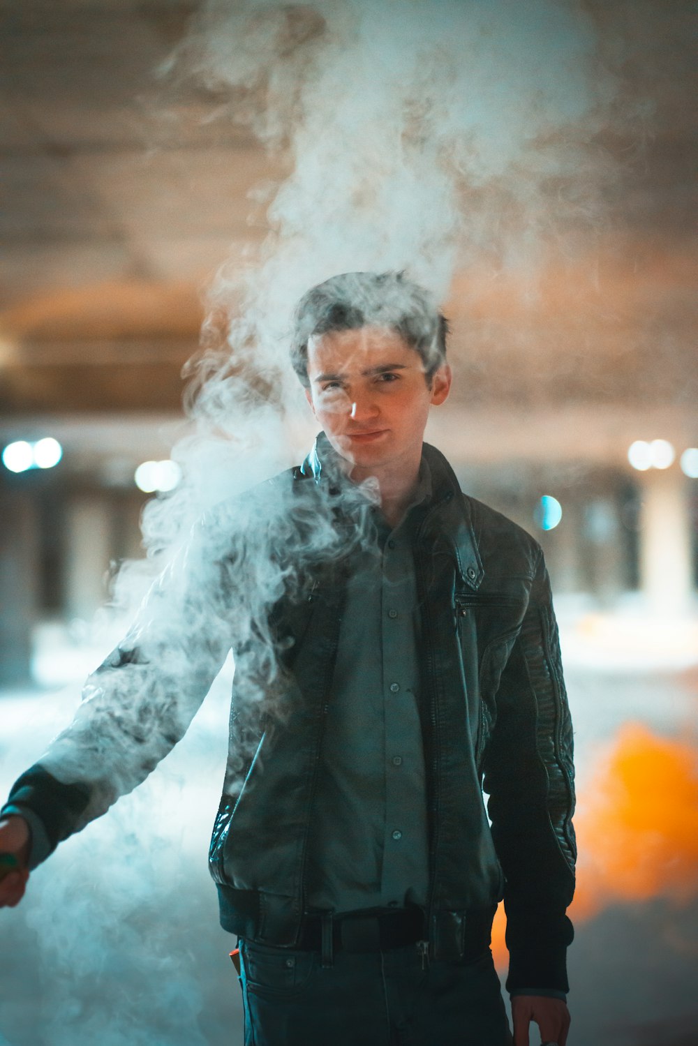 man in black jacket smoking