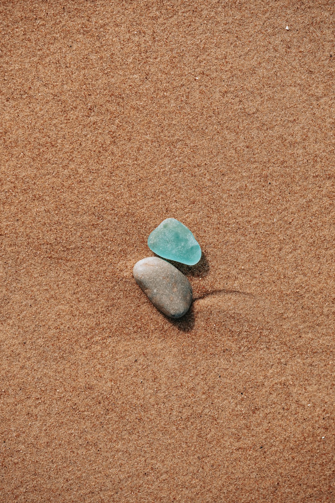 gray heart stone on brown textile