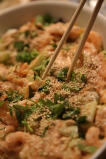 Close-up of a vibrant salad bowl with fresh greens, cherry tomatoes, and grilled salmon.