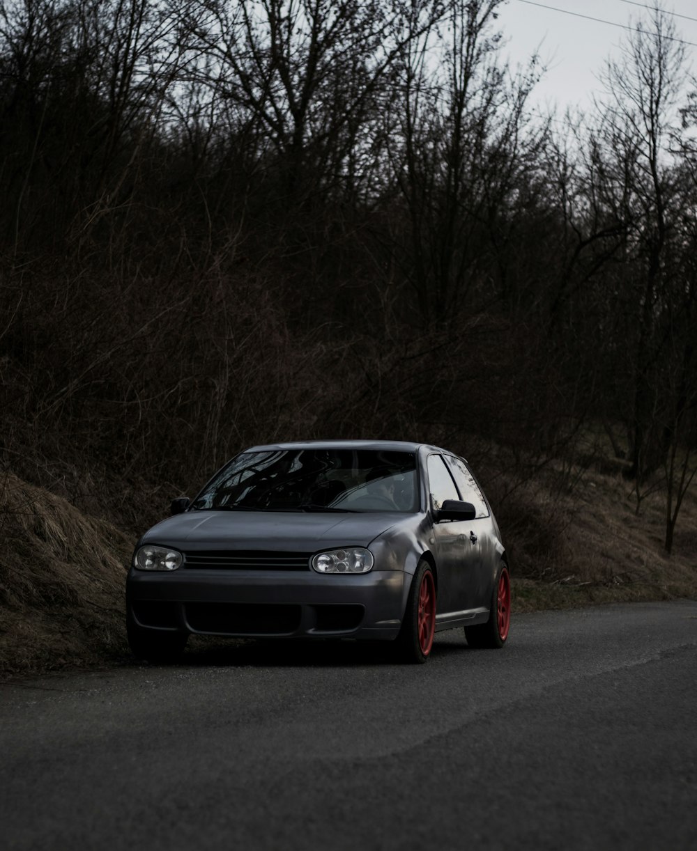 black bmw m 3 on road