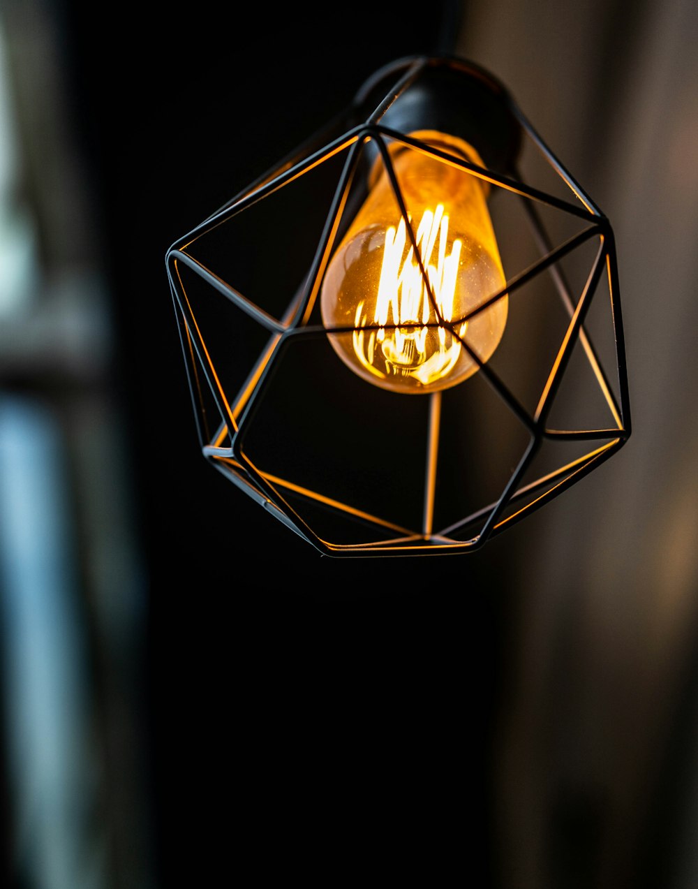 brown pendant lamp turned on in room