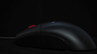 black computer mouse on black mouse pad