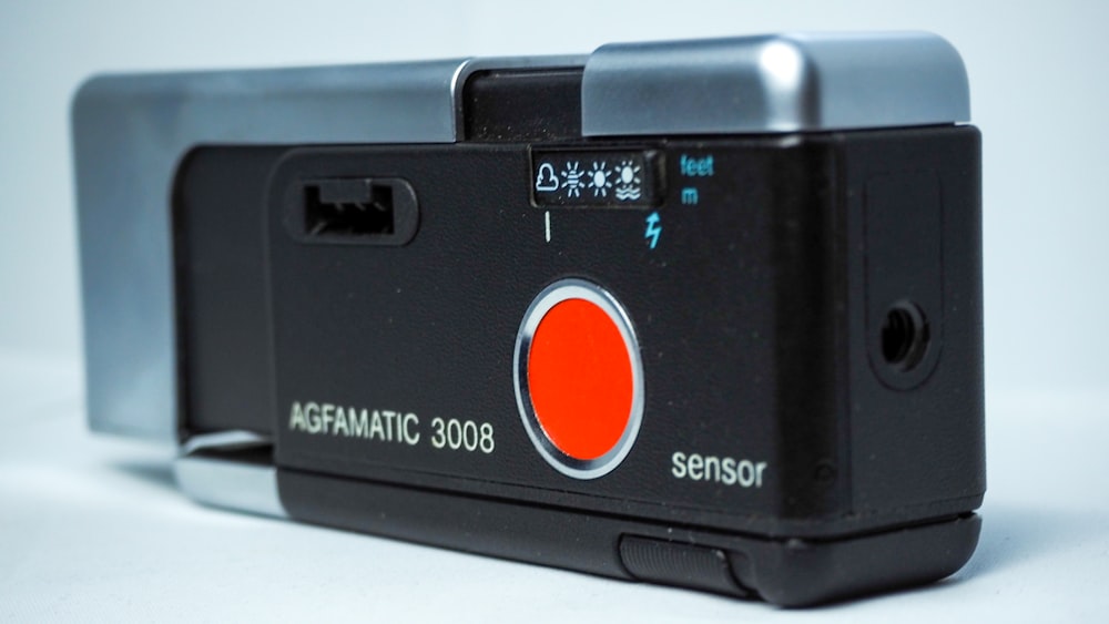 black and red polaroid camera