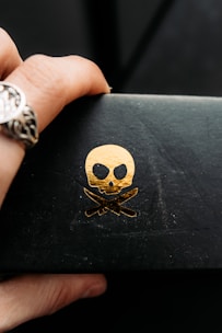 Close-up of hands holding sl8-themed collectibles and fan art.