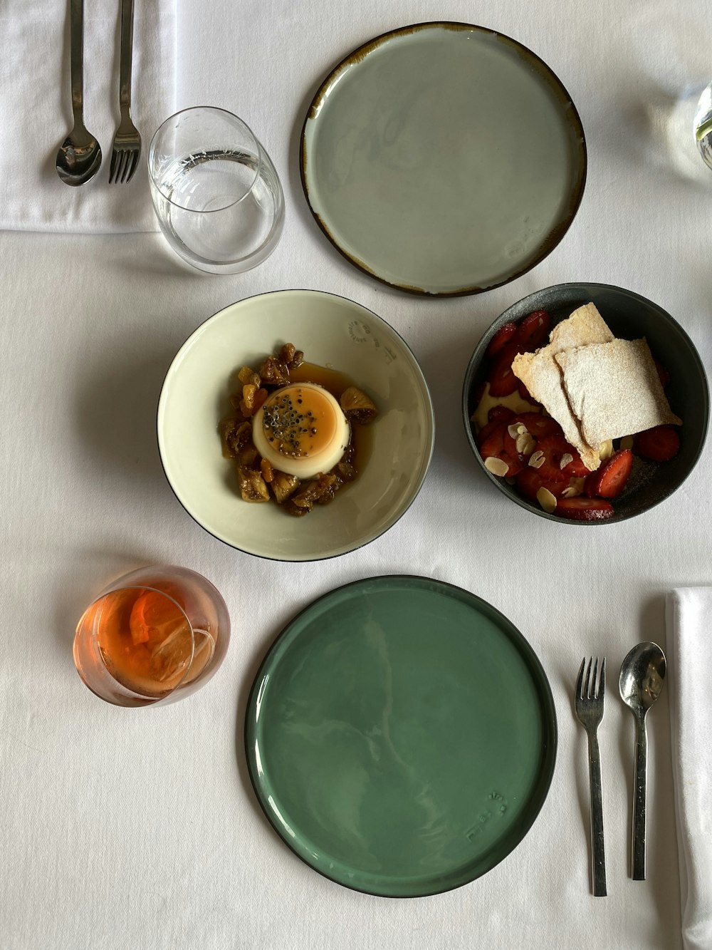 sliced bread on white ceramic plate beside stainless steel fork and bread knife