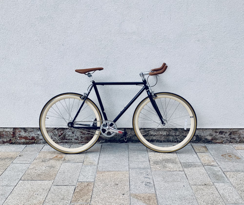 brown and white road bike on gray concrete floor