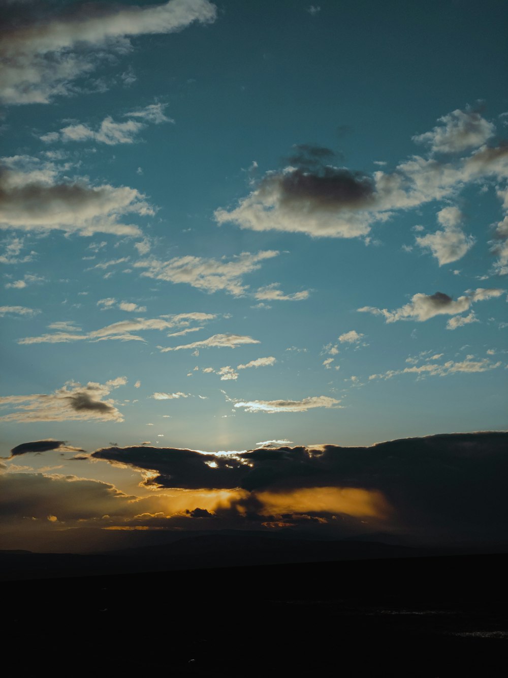 silhouette of mountain under blue sky during sunset