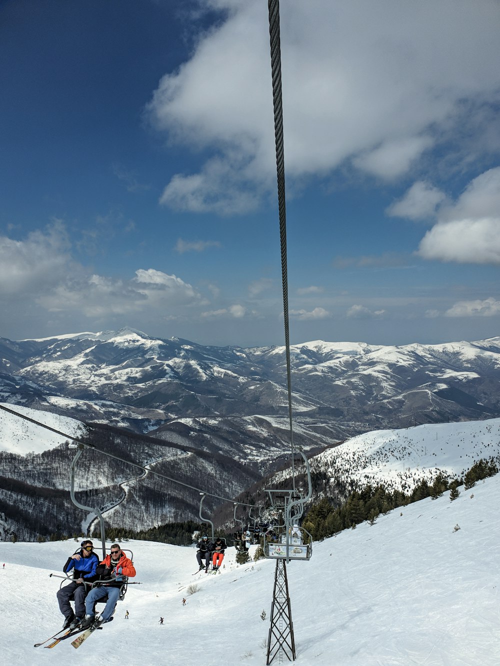 people on snow covered mountain under blue sky during daytime