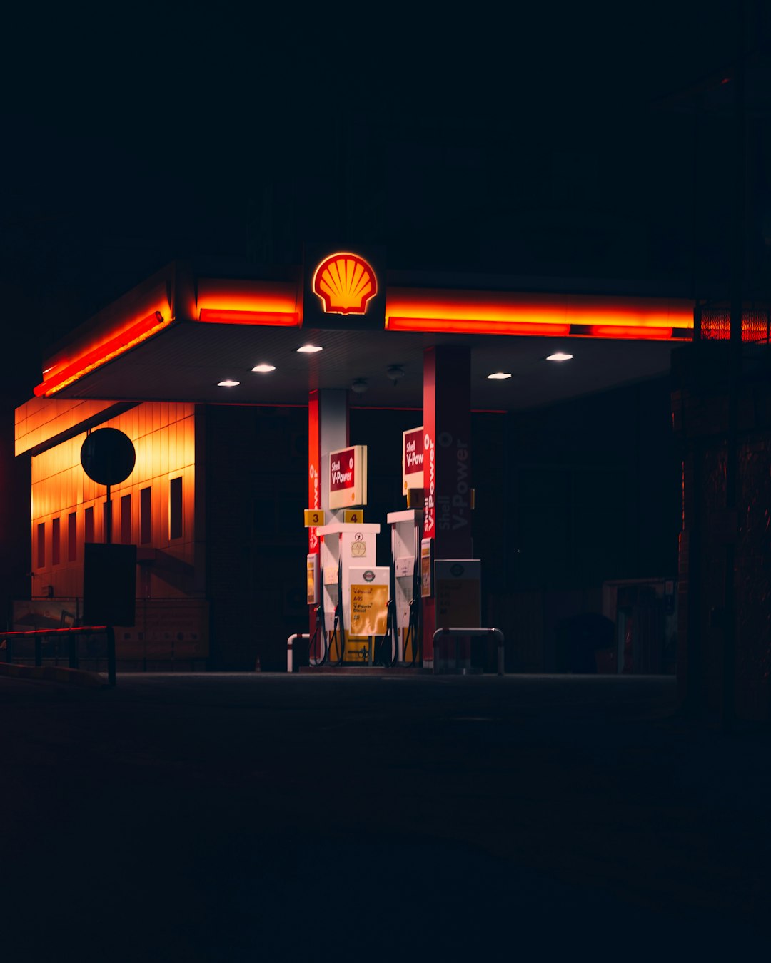 red and white store front during night time