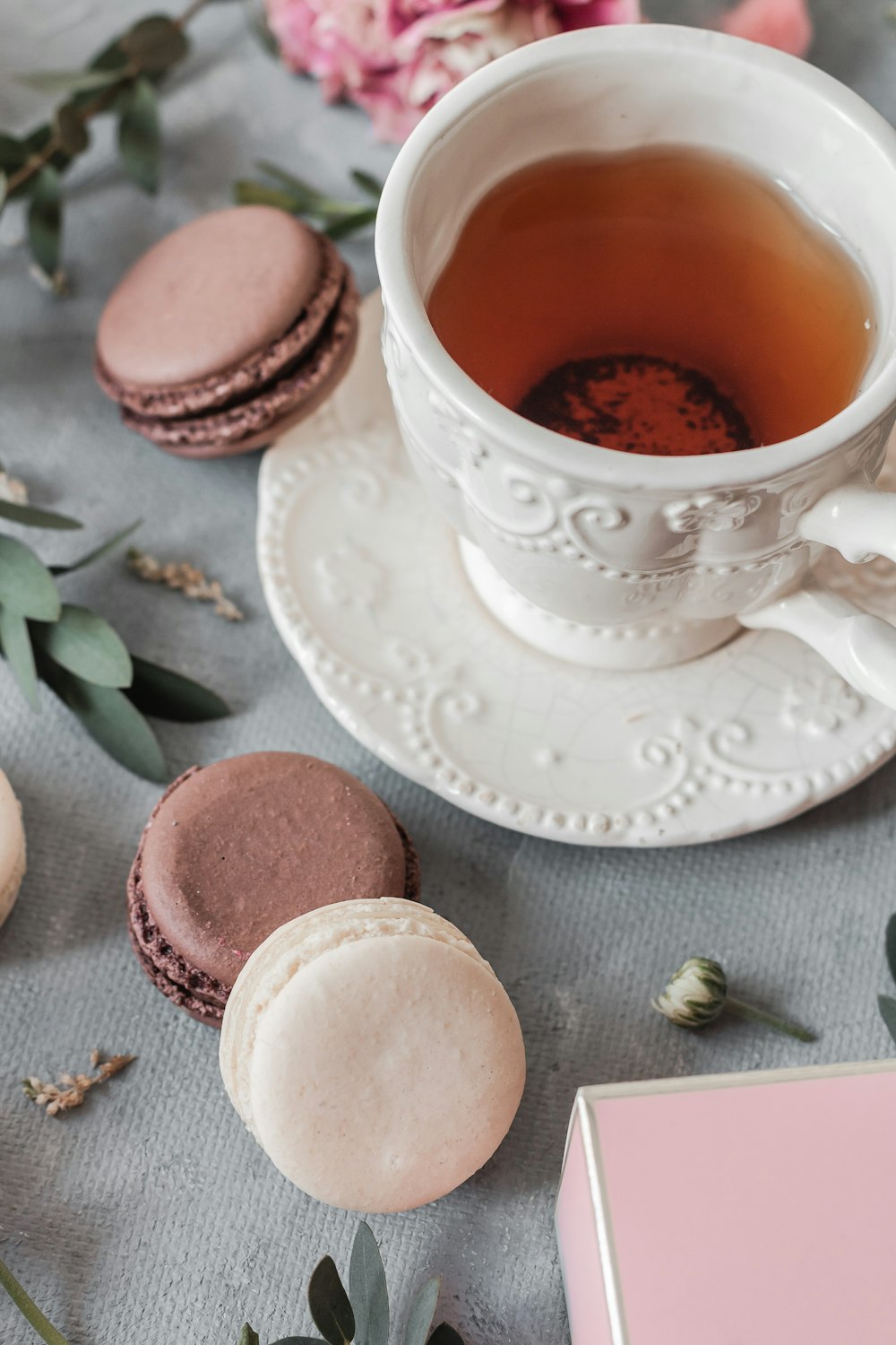 white ceramic teacup on saucer