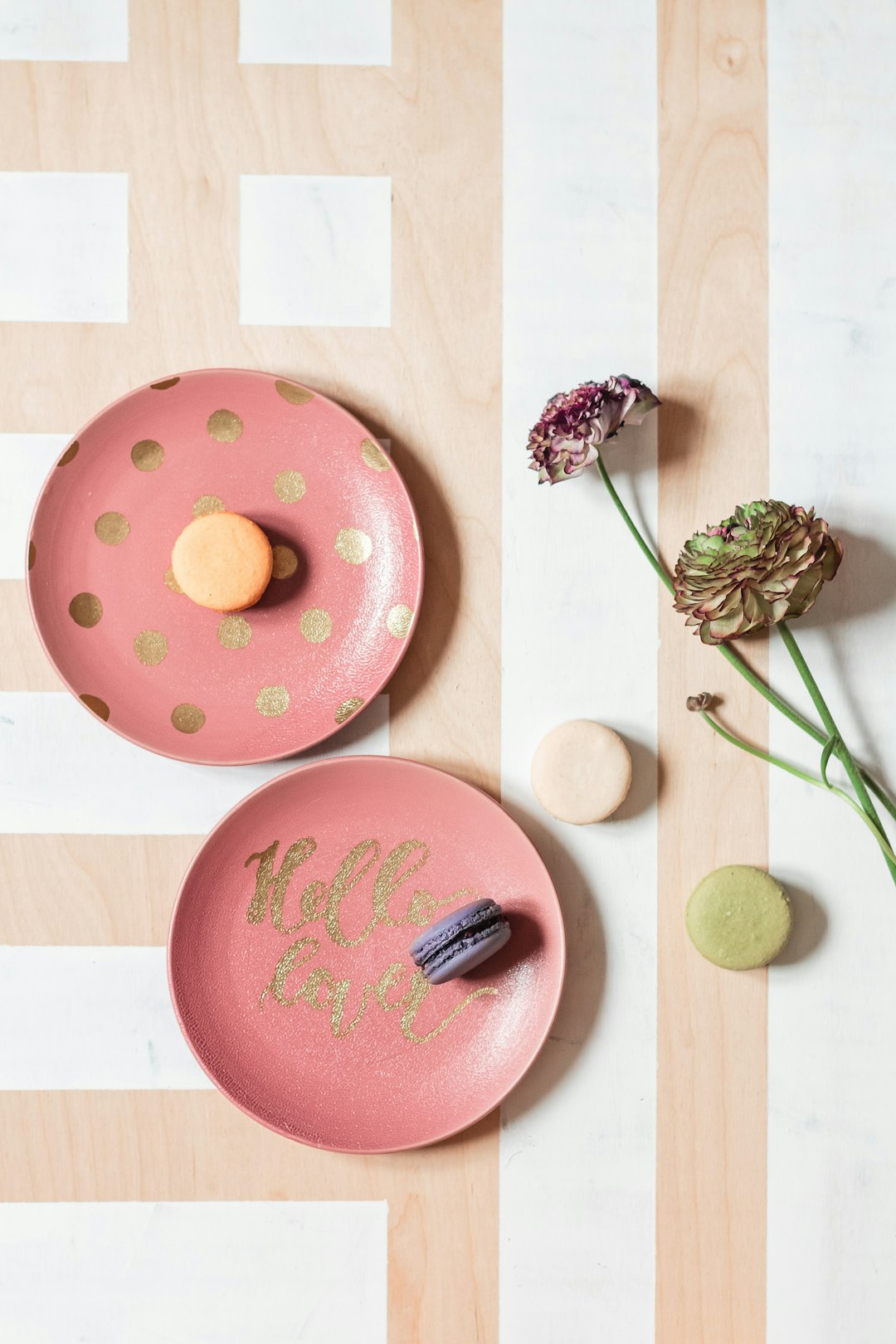 pink and brown doughnut with pink and green flowers