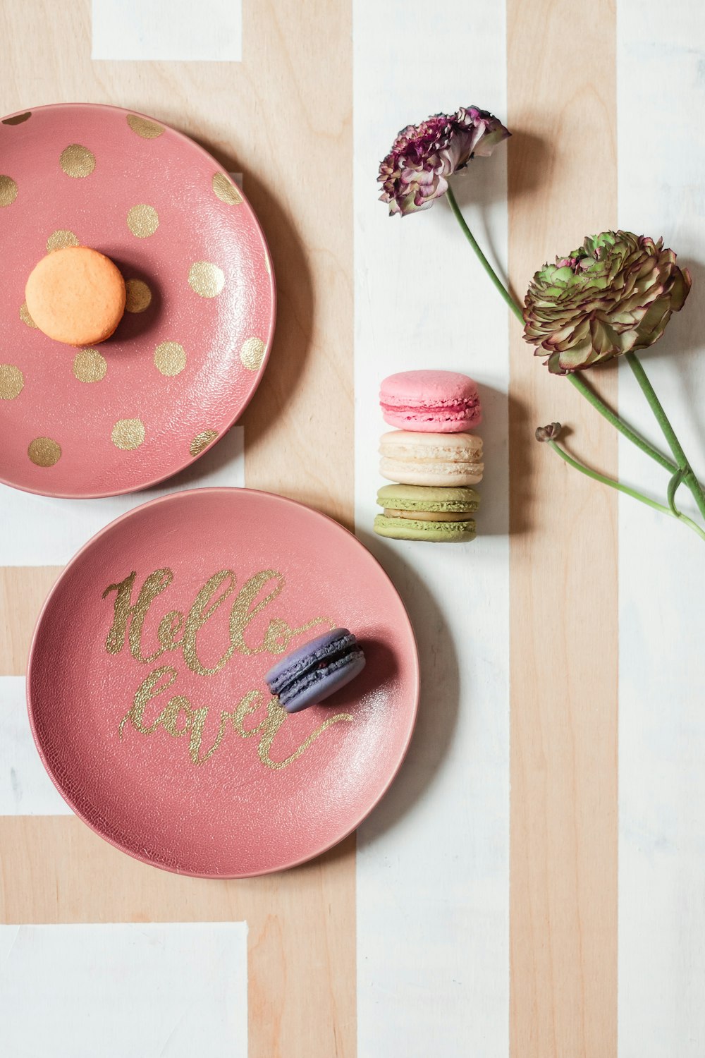 pink and white polka dot round plate with pink and yellow thread