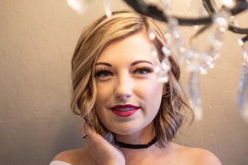 Close-up headshot of Crystal with a confident smile and minimalist makeup.