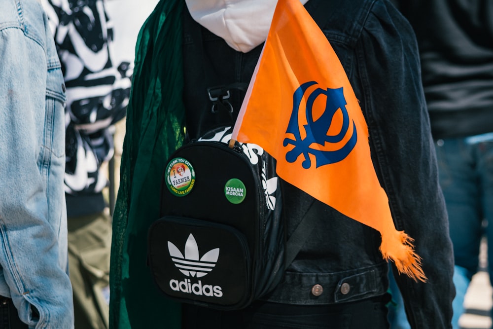 black and yellow adidas backpack