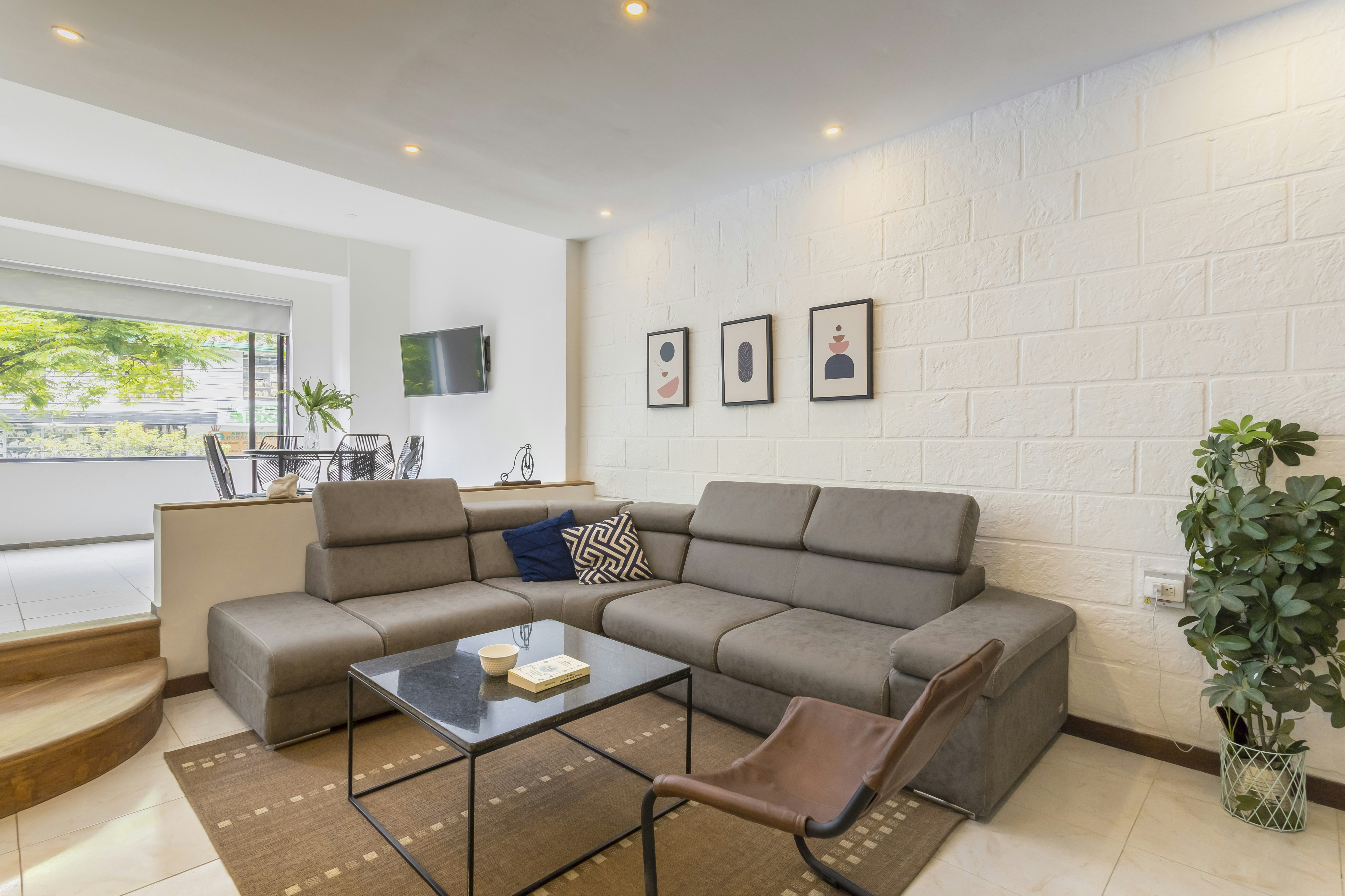 Gray mid-century modern sofa in bright living room