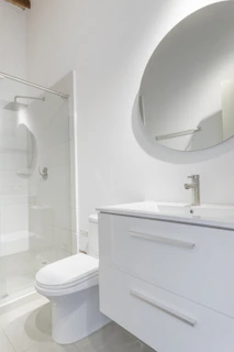 Bright bathroom with new fixtures and a stylish vanity unit