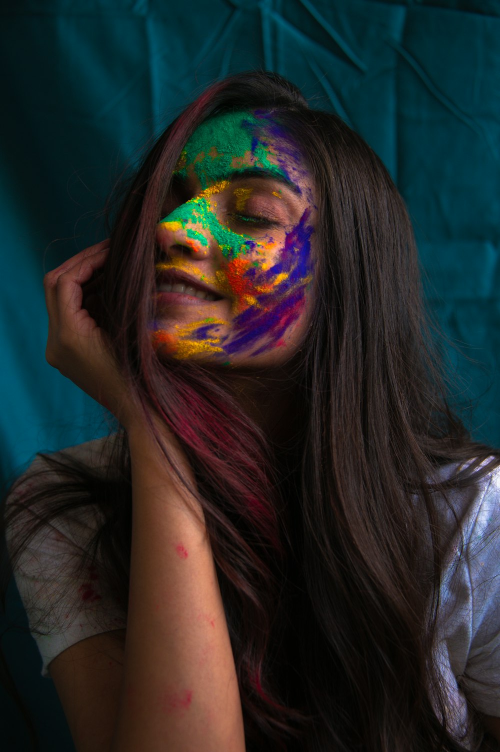 woman with purple and yellow face paint