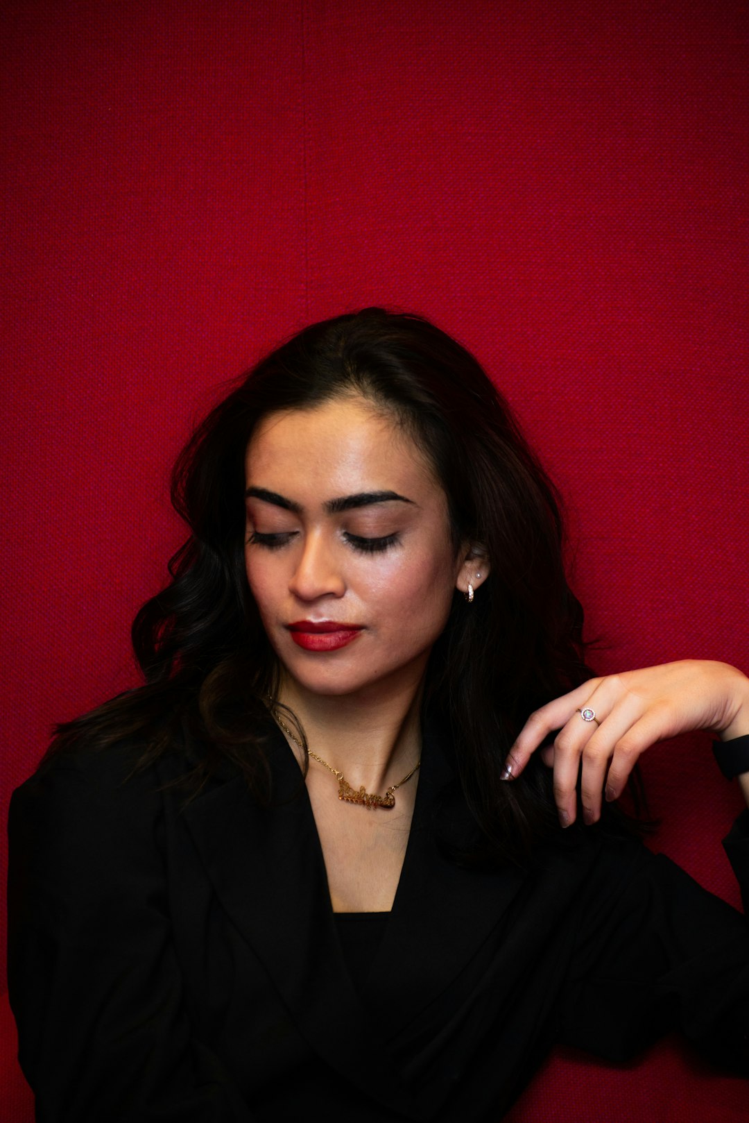 woman in black blazer smiling