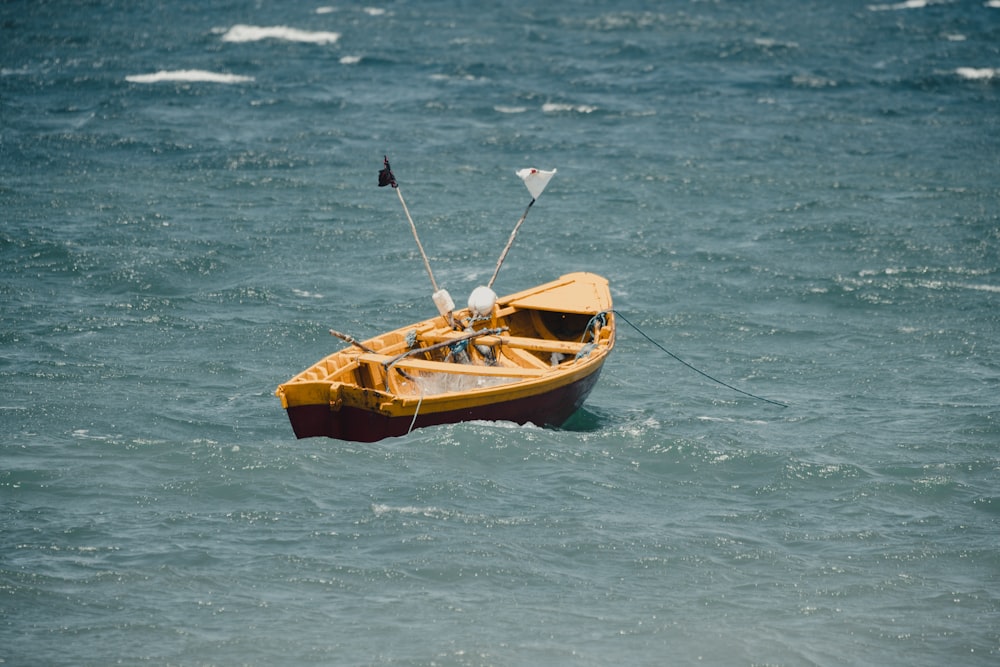 brown and black boat on body of water during daytime