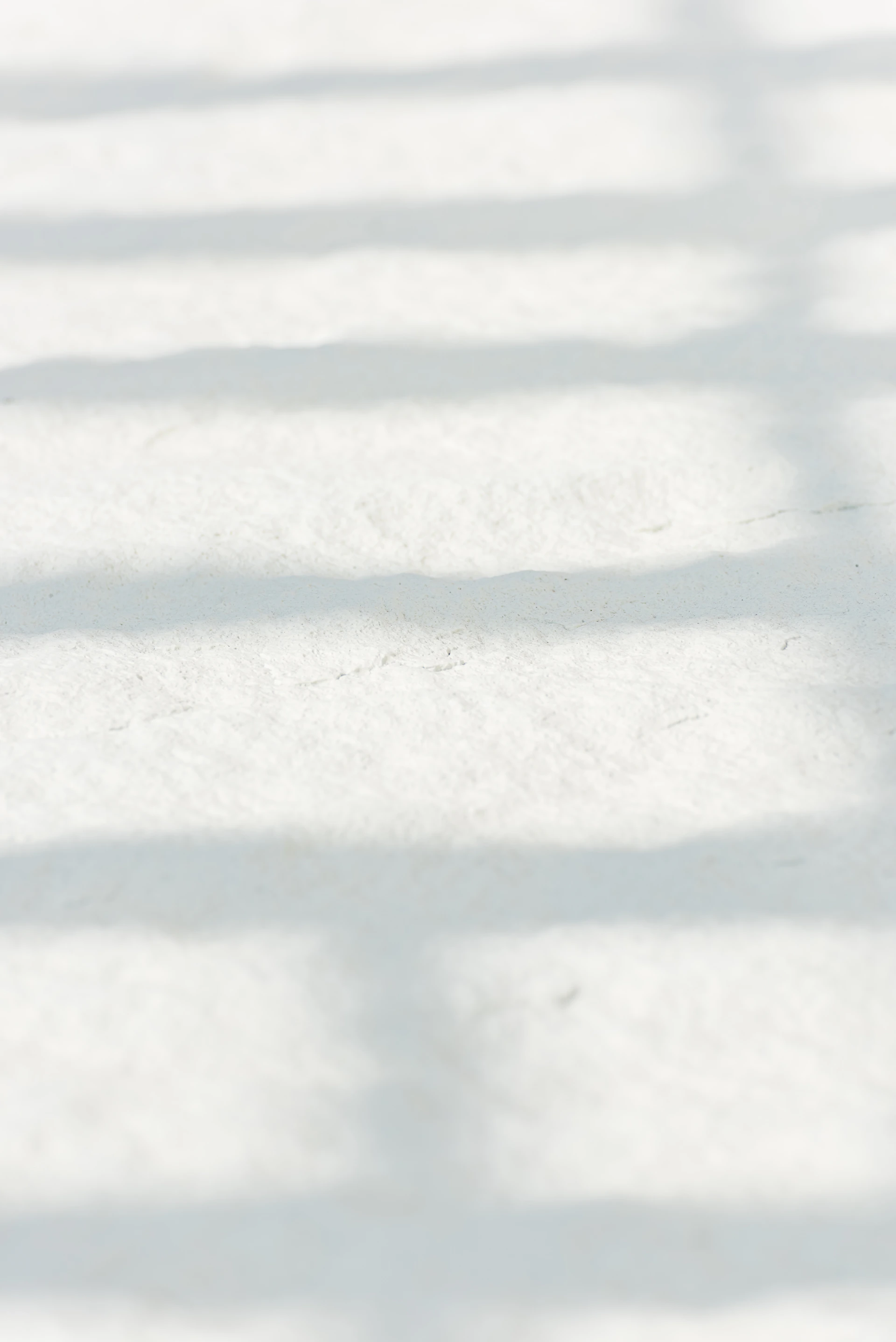 white snow on brown soil