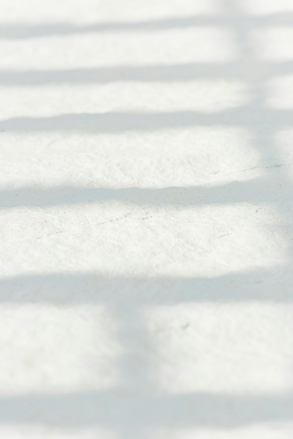 white snow on brown soil