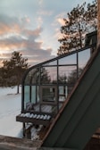 Modern modular container home with large windows in a snowy landscape