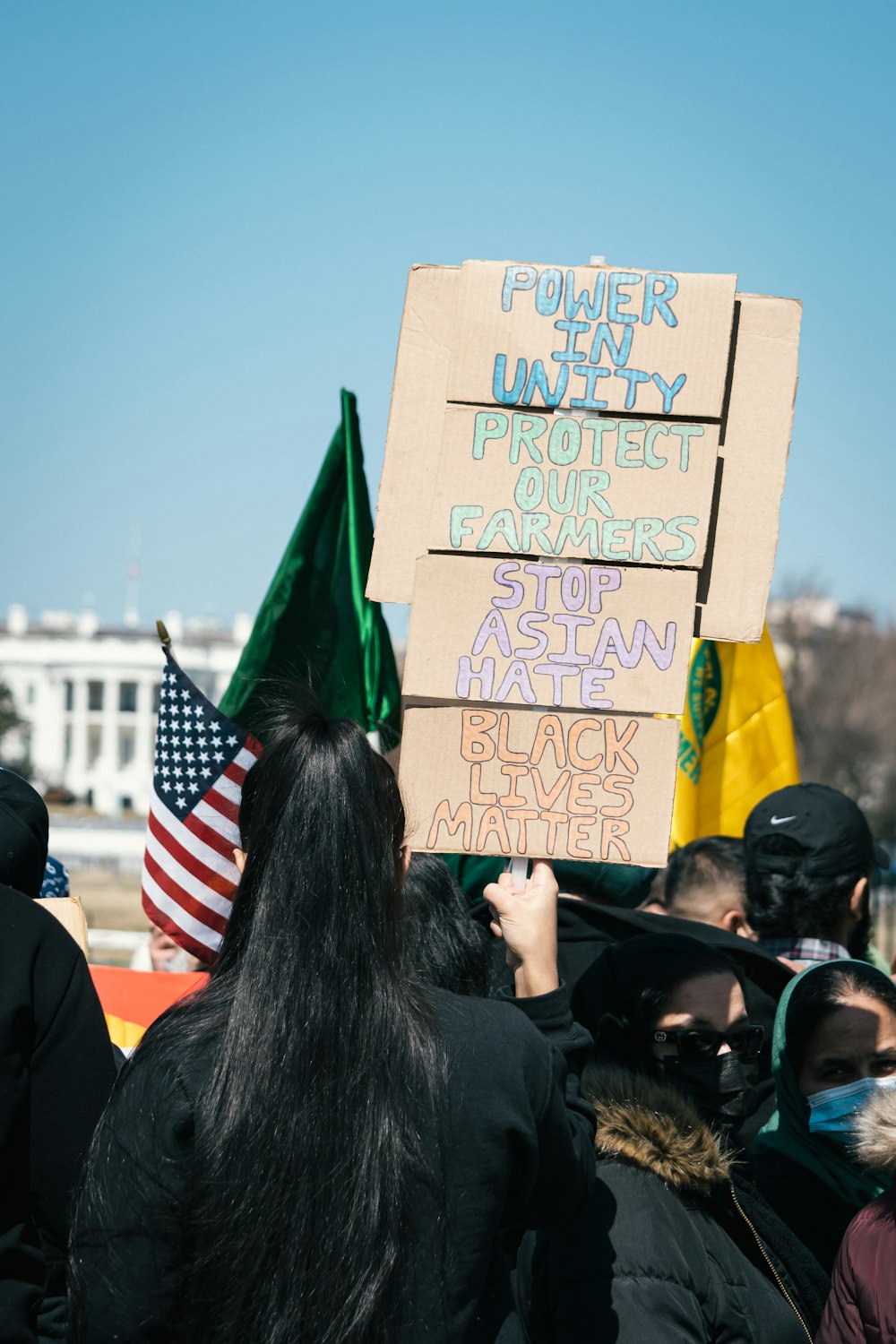 people holding banner during daytime