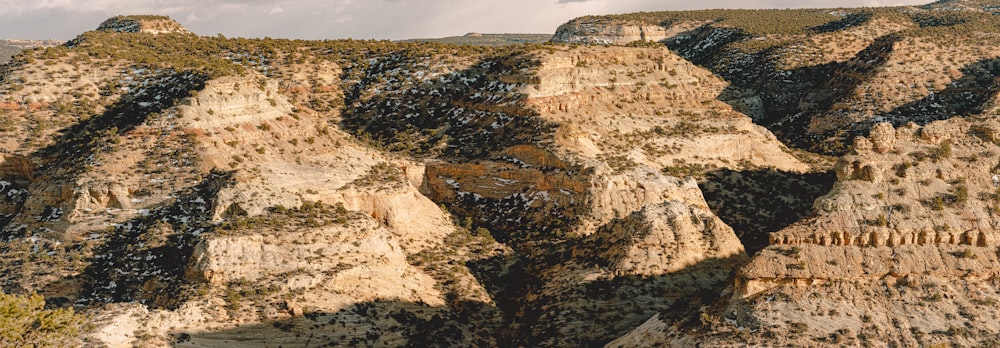 brown rocky mountain under gray sky during daytime