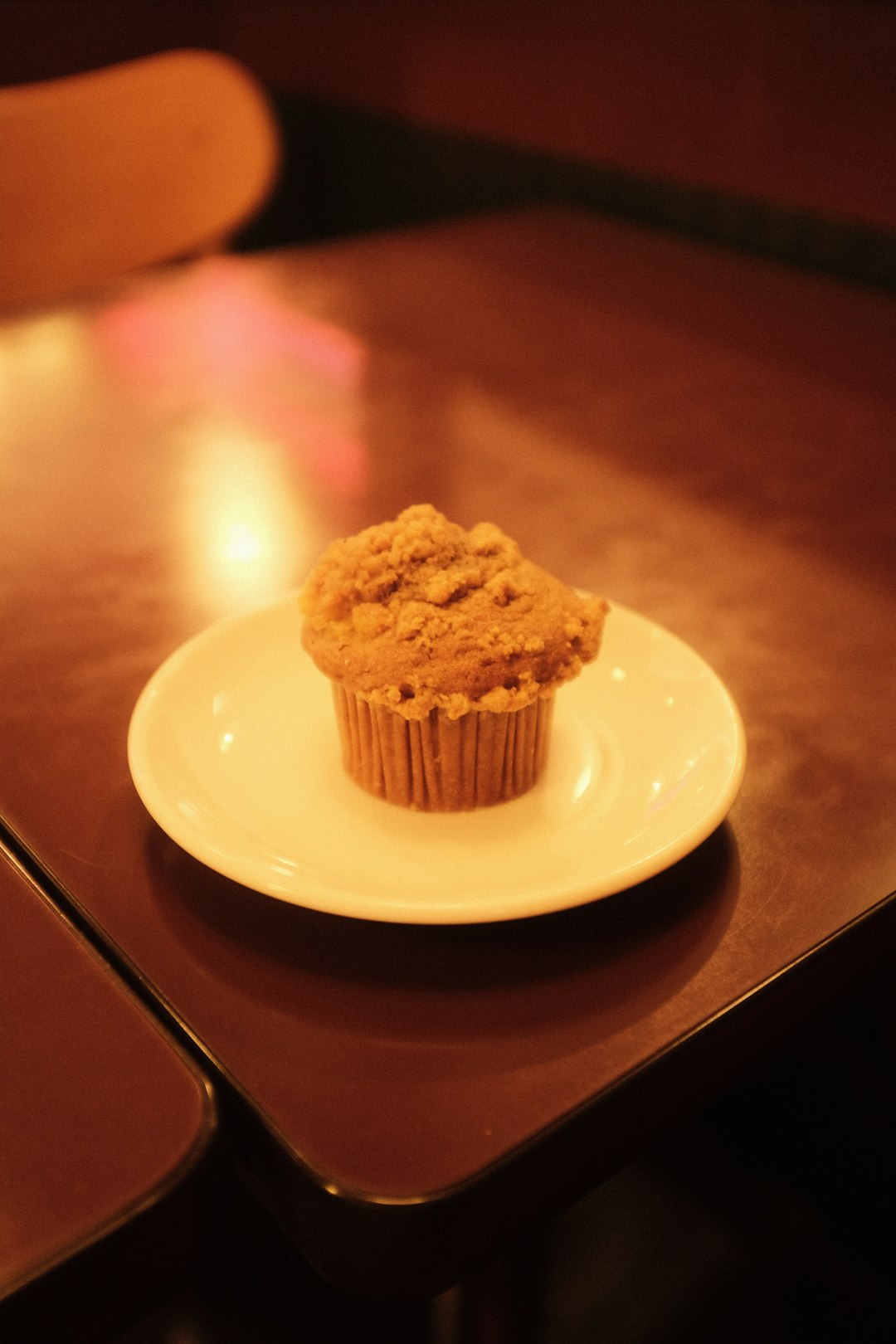 brown cupcake on white ceramic plate