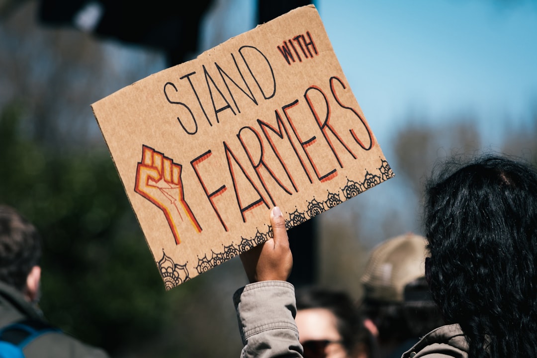 person holding happy birthday to you signage, Stand with Farmers
