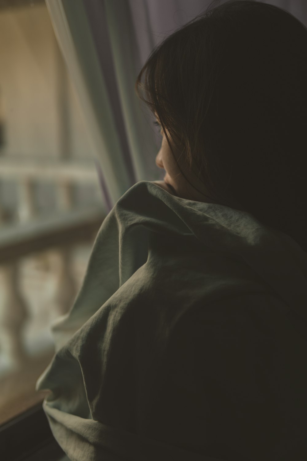 woman in black shirt looking at window photo – Free Sad woman Image on  Unsplash