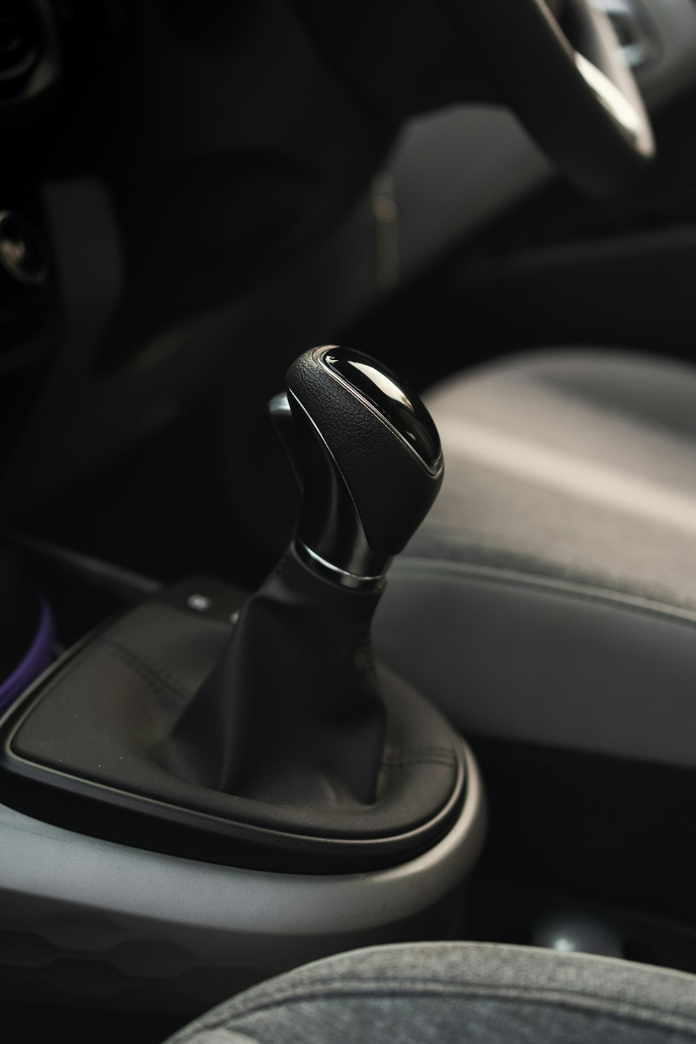 black and silver car gear shift lever