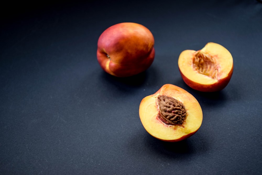 orange fruit on black surface