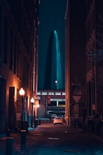 cars parked on side of the road during night time