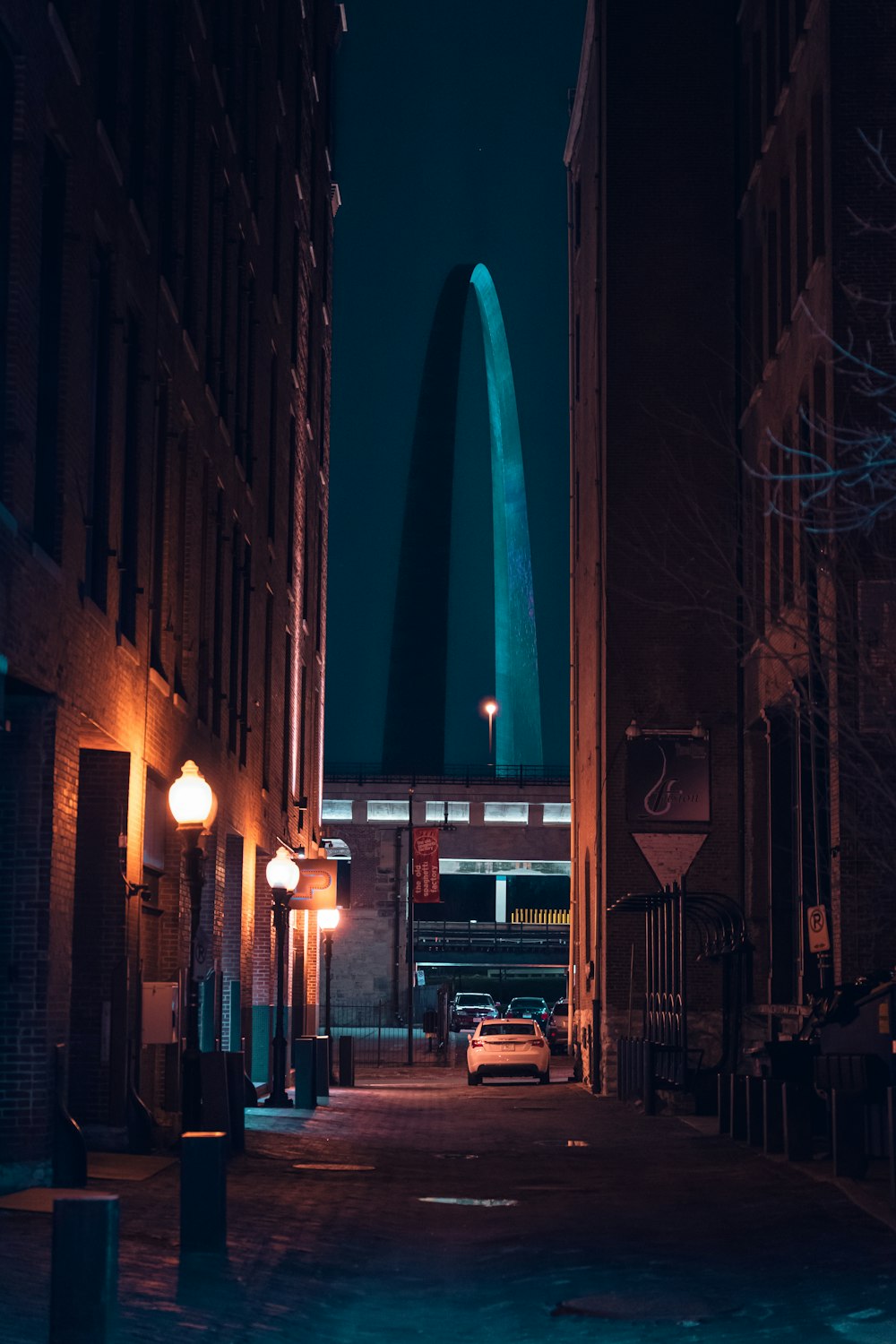 cars parked on side of the road during night time