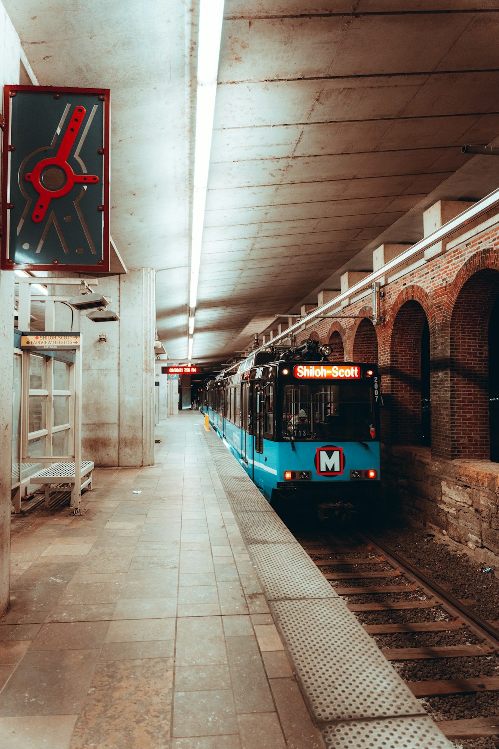 red and white train in train station