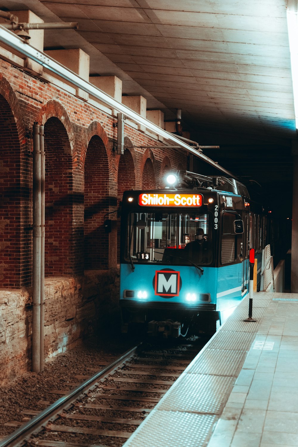 blue and white train on rail road