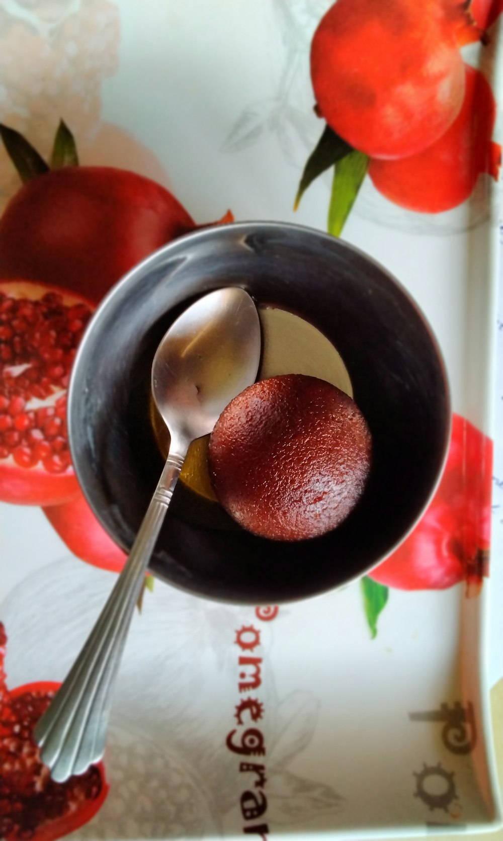 stainless steel spoon on black ceramic bowl