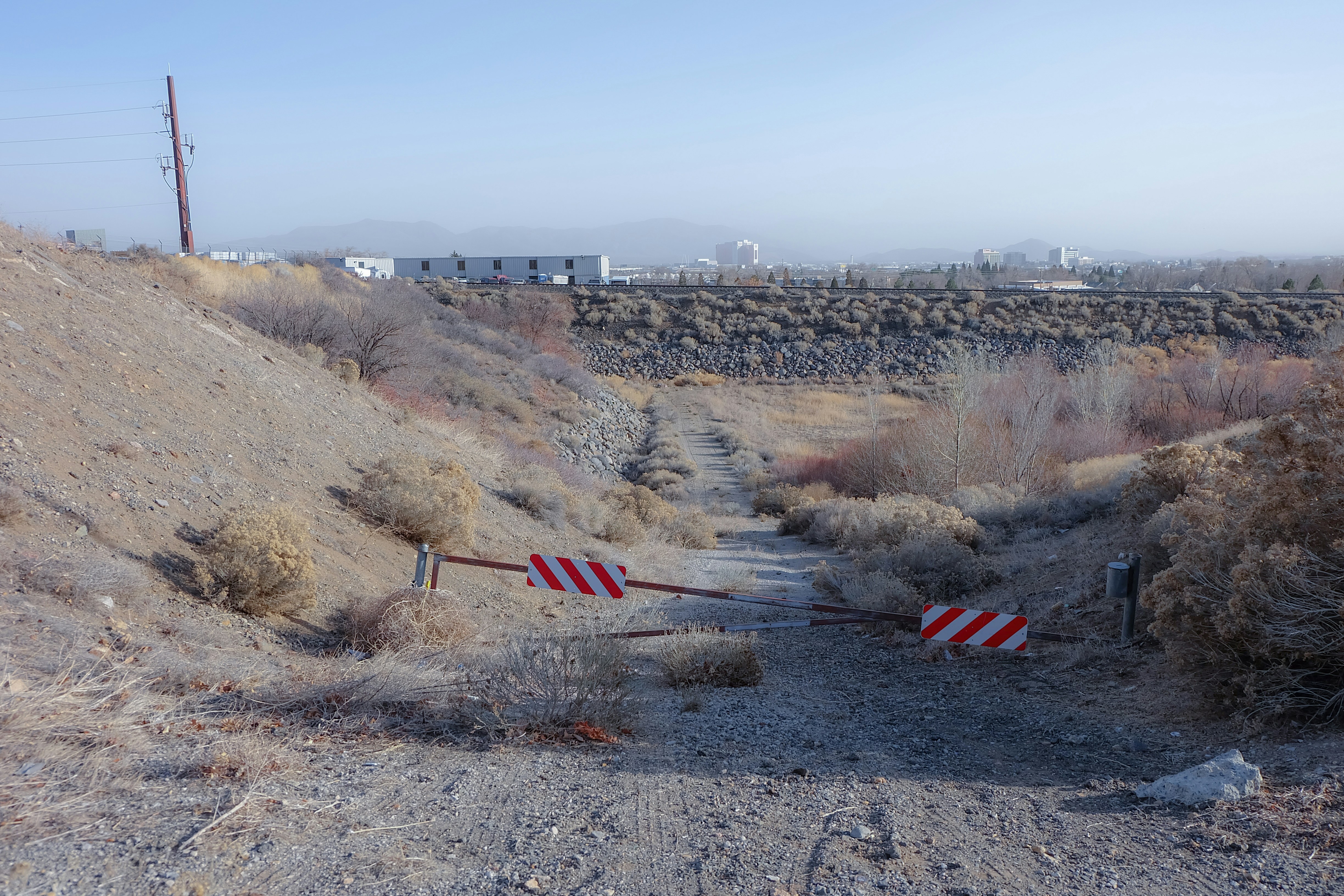 red and white striped flag on brown field during daytime