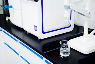 clear drinking glass on black table