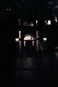 A secure entryway illuminated warmly during evening business hours.