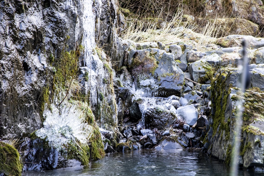 gray rock formation on river during daytime