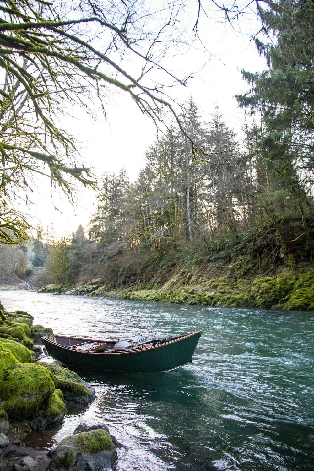 brown boat on river during daytime