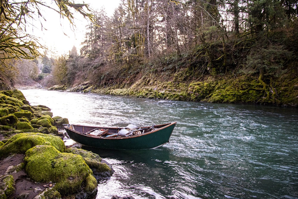 red and white boat on river during daytime