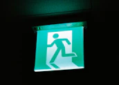 Emergency exit door with clear signage and automated opening mechanism.