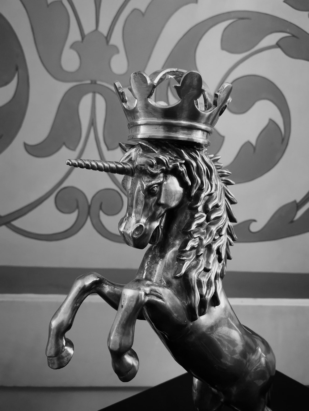 black horse figurine on white surface